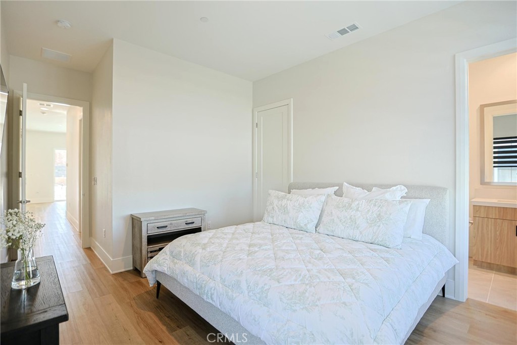 32213 Daybrook Terrace Temecula, CA 92591 - Photo 50 of 75 a bedroom with a bed and wooden floor
