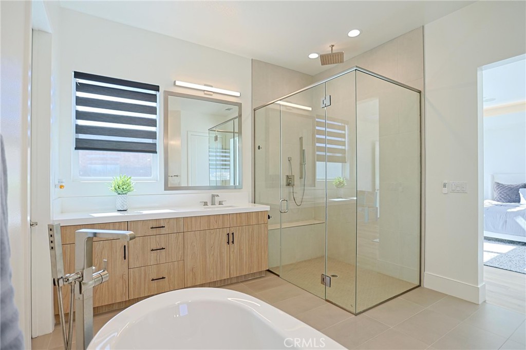 32213 Daybrook Terrace Temecula, CA 92591 - Photo 62 of 75 a bathroom with a double vanity sink mirror and shower