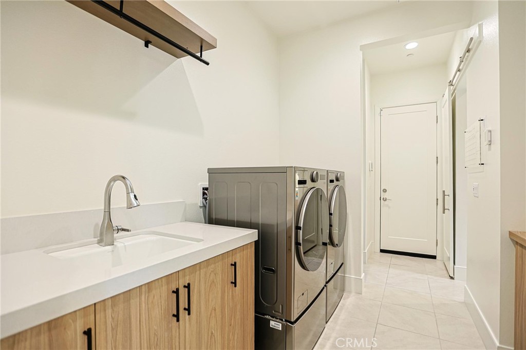 32213 Daybrook Terrace Temecula, CA 92591 - Photo 70 of 75 a utility room with dryer and washer