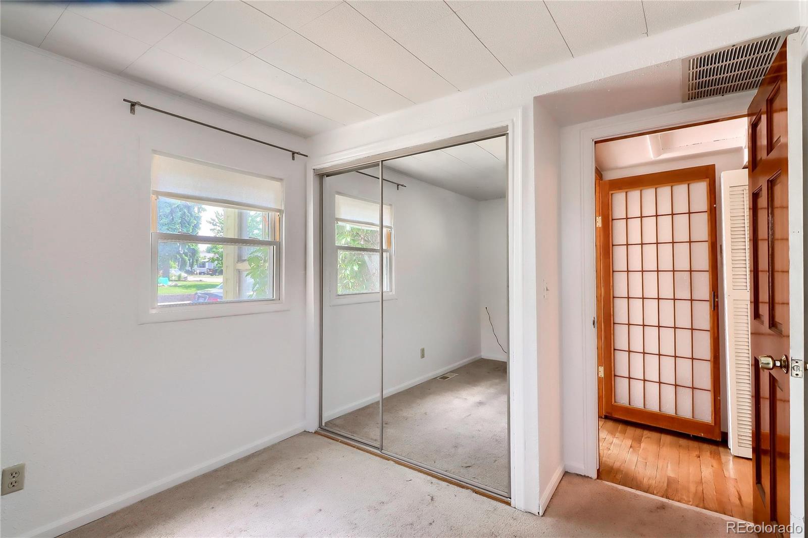 6201 East Tennessee Avenue Denver, CO 80224 - Photo 12 of 25 an empty room with windows