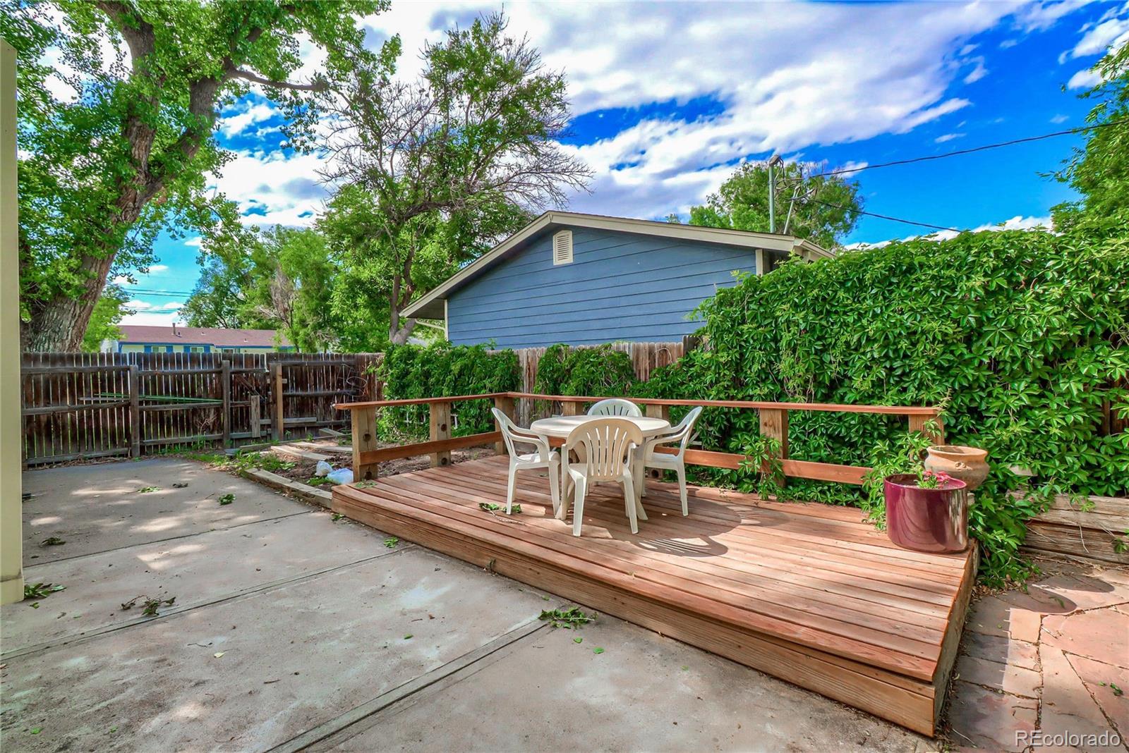 6201 East Tennessee Avenue Denver, CO 80224 - Photo 18 of 25 a view of a sitting area with furniture in backyard