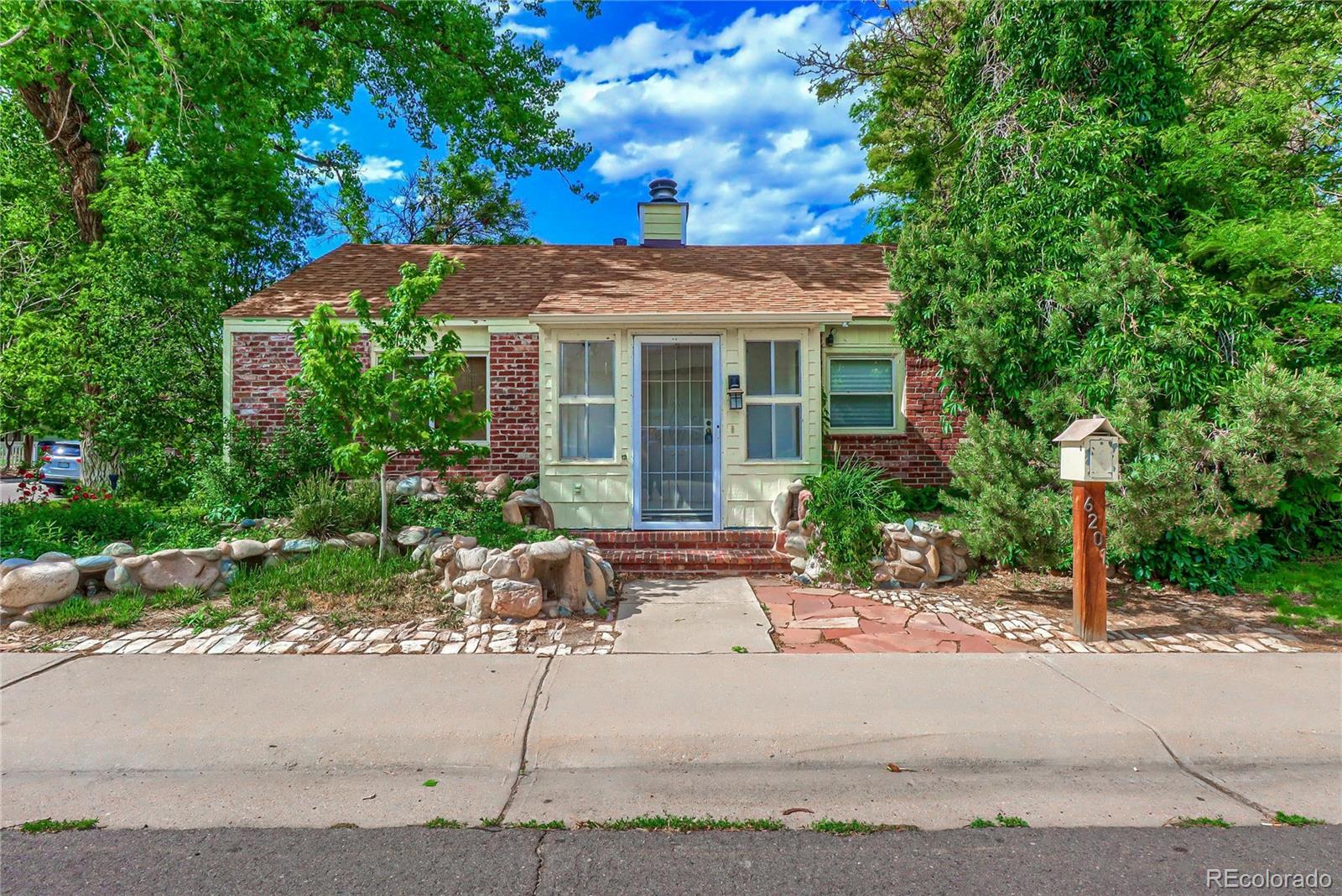 6201 East Tennessee Avenue Denver, CO 80224 - Photo 2 of 25 a view of a house with yard and tree s