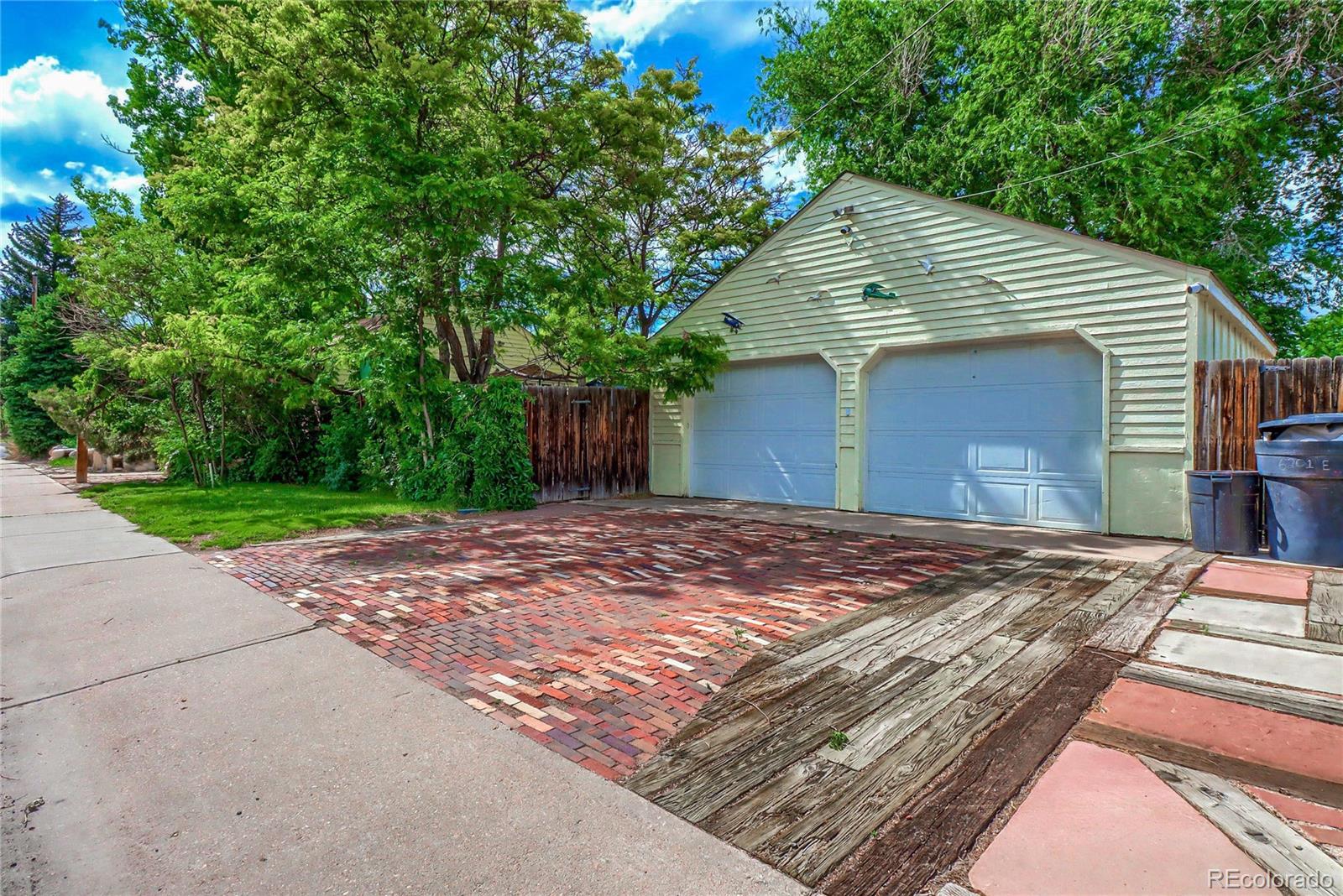 6201 East Tennessee Avenue Denver, CO 80224 - Photo 21 of 25 a view of a house with a yard