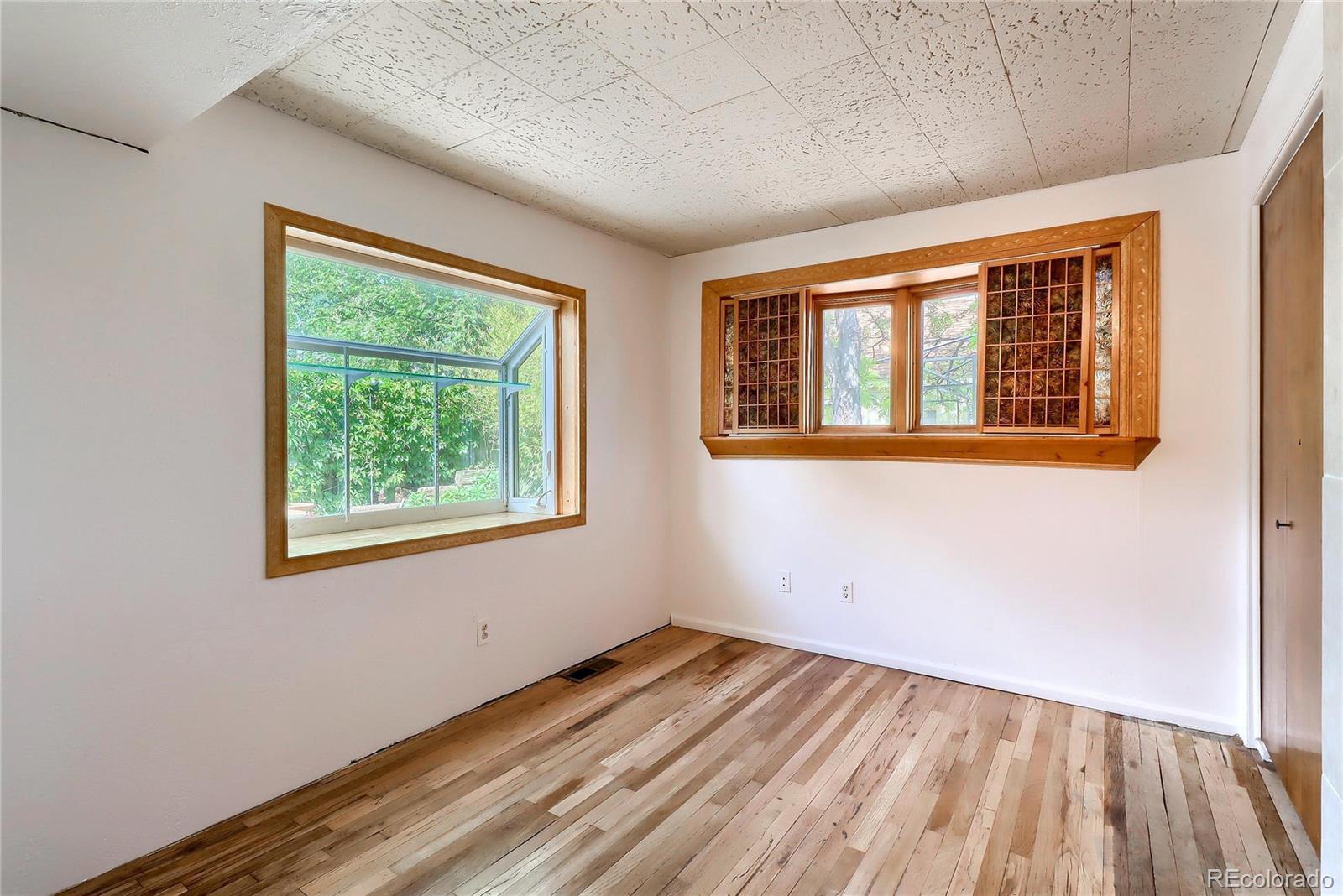 6201 East Tennessee Avenue Denver, CO 80224 - Photo 8 of 25 an empty room with a window