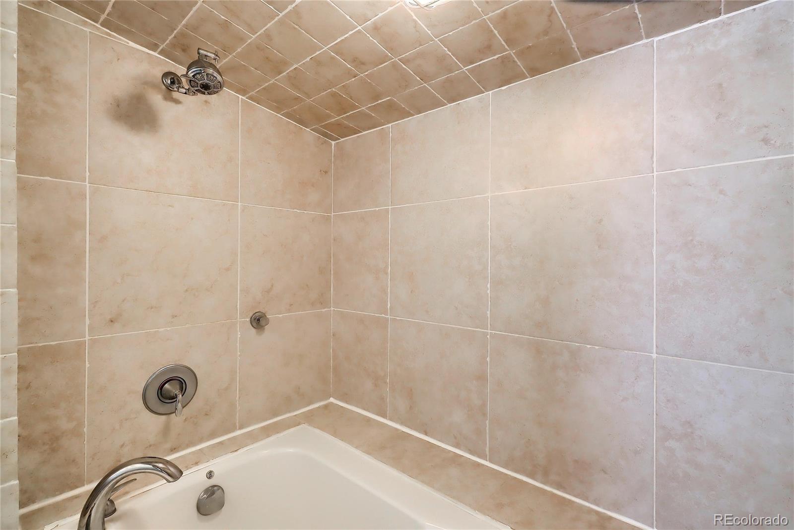 6201 East Tennessee Avenue Denver, CO 80224 - Photo 9 of 25 a bathroom with a shower