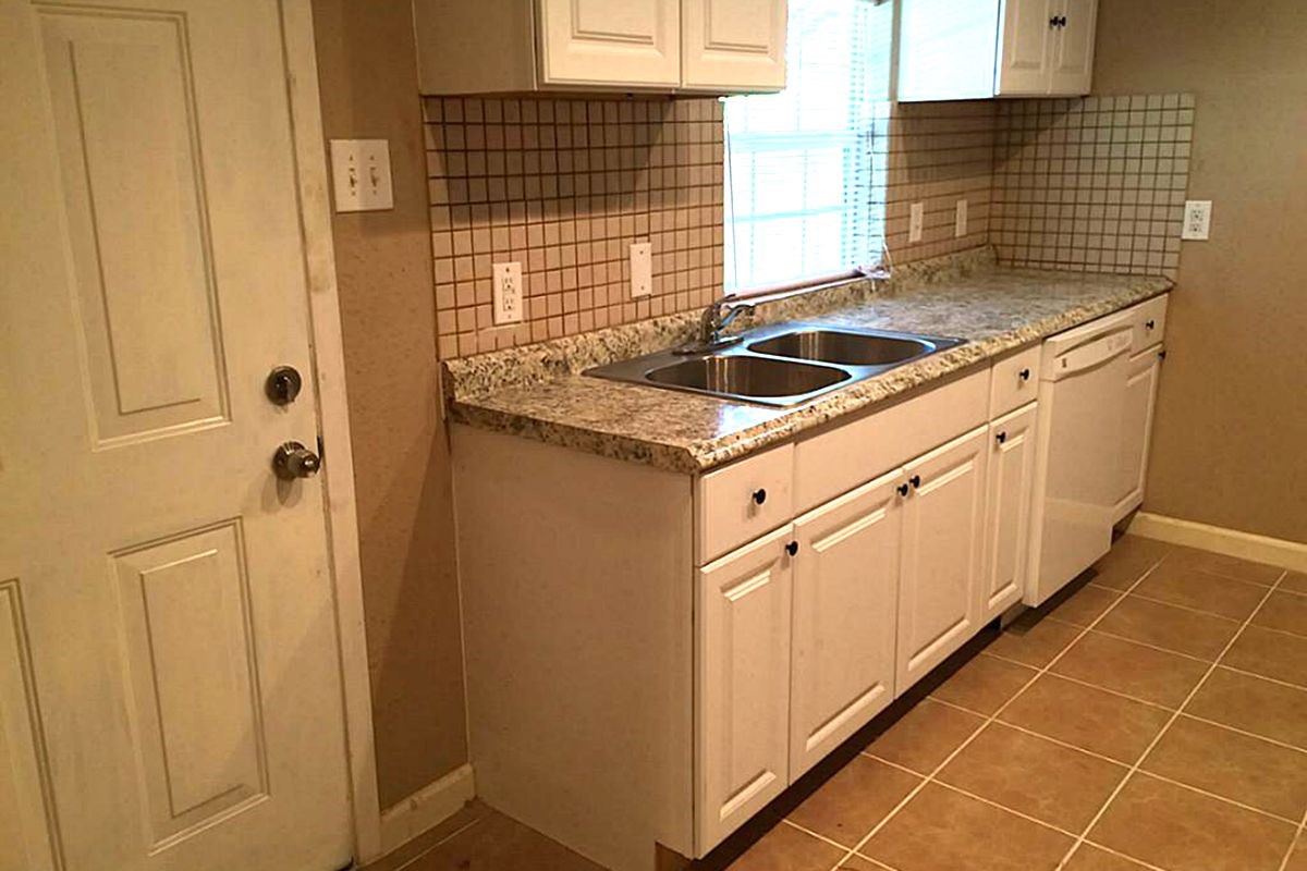 5103 Yellowstone Boulevard Houston, TX 77021 - Photo 4 of 10 a kitchen with a sink and cabinets