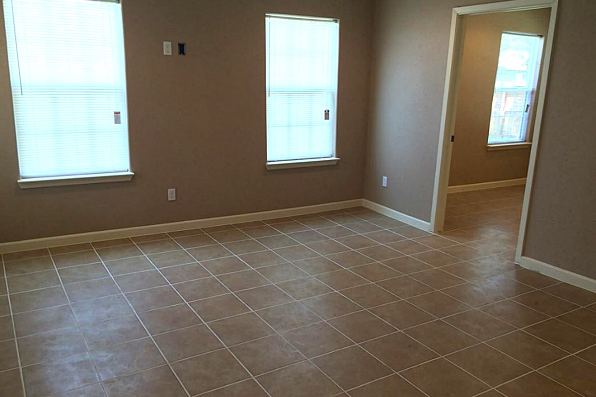 5103 Yellowstone Boulevard Houston, TX 77021 - Photo 8 of 10 a view of an empty room with a window and a bathroom