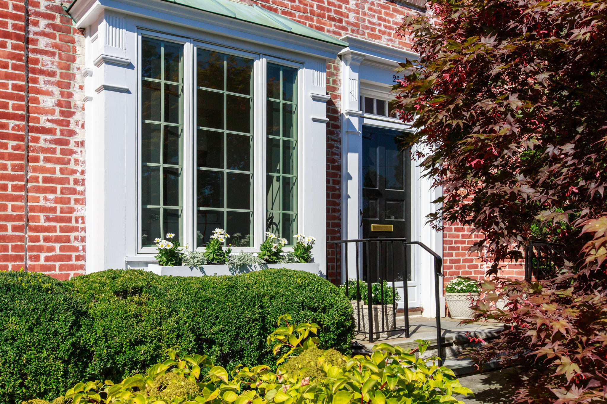 26 Mead Street, Unit 26 New Canaan, CT 06840 - Photo 1 of 28 a front view of a house with a yard