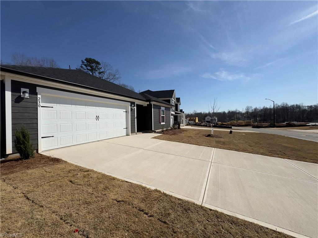 230 Wolfstone Drive Graham, NC 27253 - Photo 3 of 16 The driveway can accommodate 2 more cars.