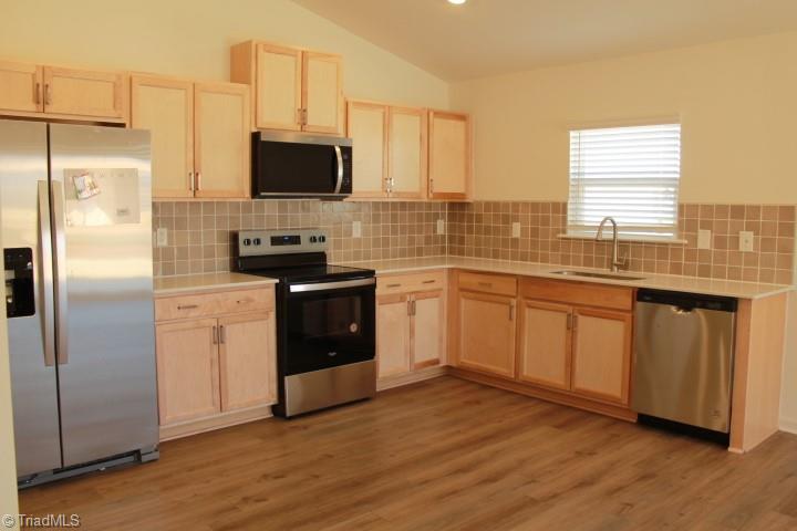230 Wolfstone Drive Graham, NC 27253 - Photo 5 of 16 Brand new stainless steel appliances.