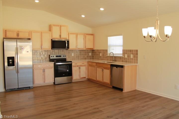 230 Wolfstone Drive Graham, NC 27253 - Photo 6 of 16 Open concept kitchen and dining room
