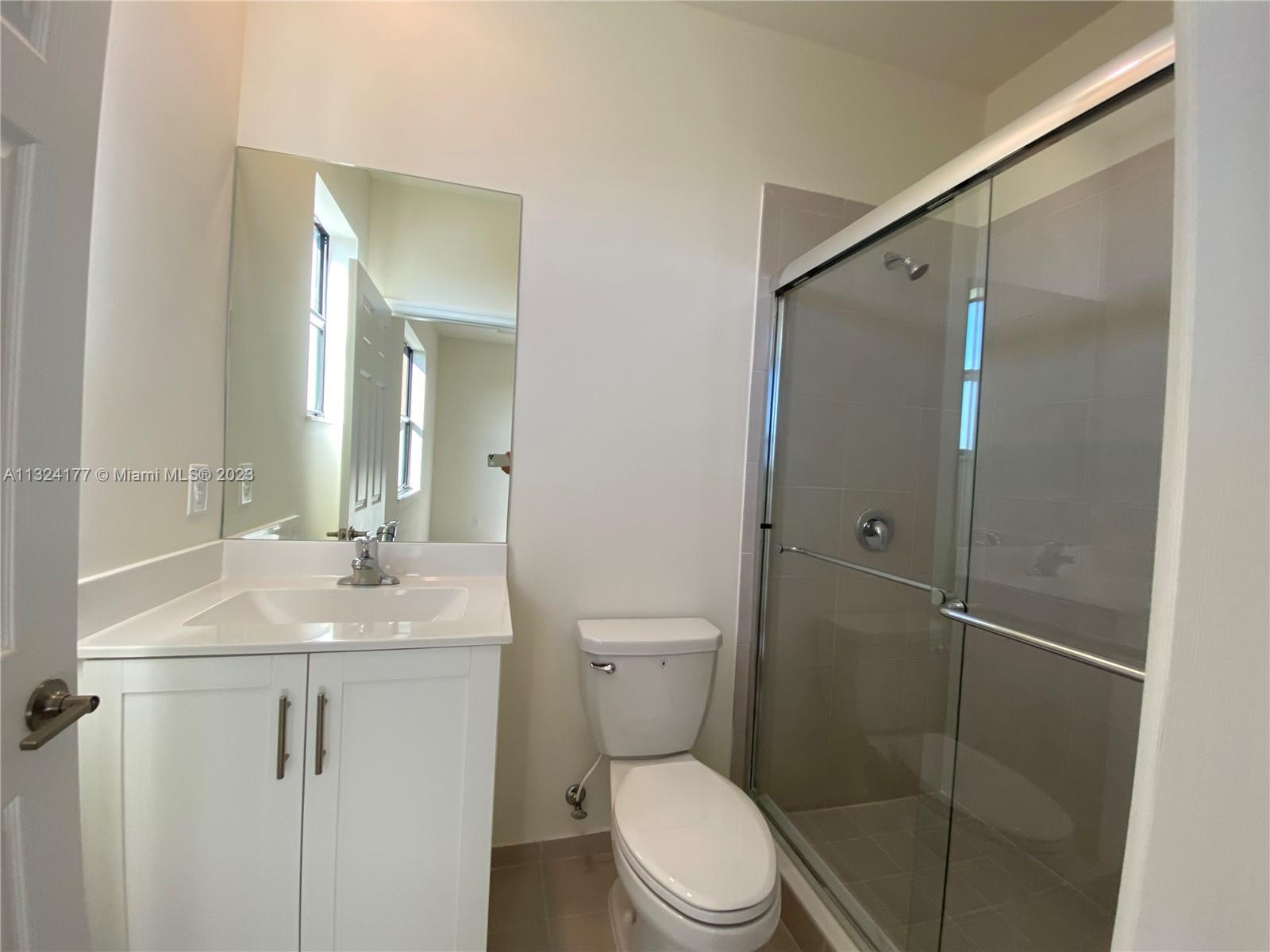 Hialeah Hialeah, FL 33018 - Photo 11 of 30 a bathroom with a toilet a sink and shower