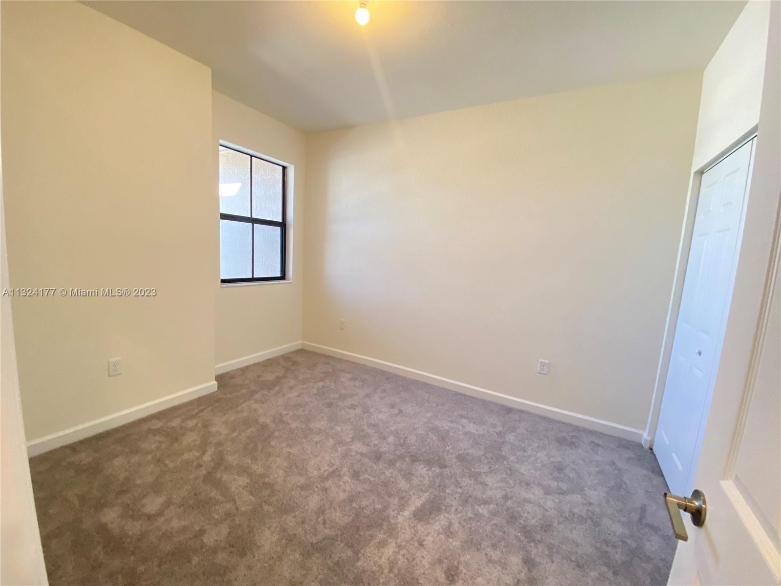 Hialeah Hialeah, FL 33018 - Photo 12 of 30 an empty room with windows