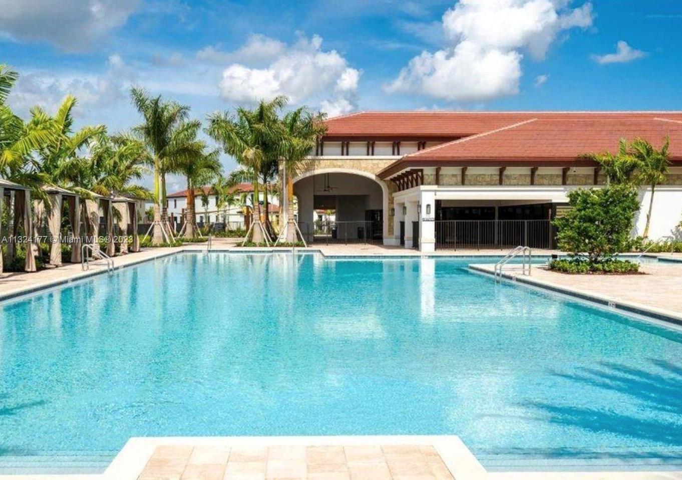 Hialeah Hialeah, FL 33018 - Photo 21 of 30 a view of swimming pool with lawn chairs and potted plants