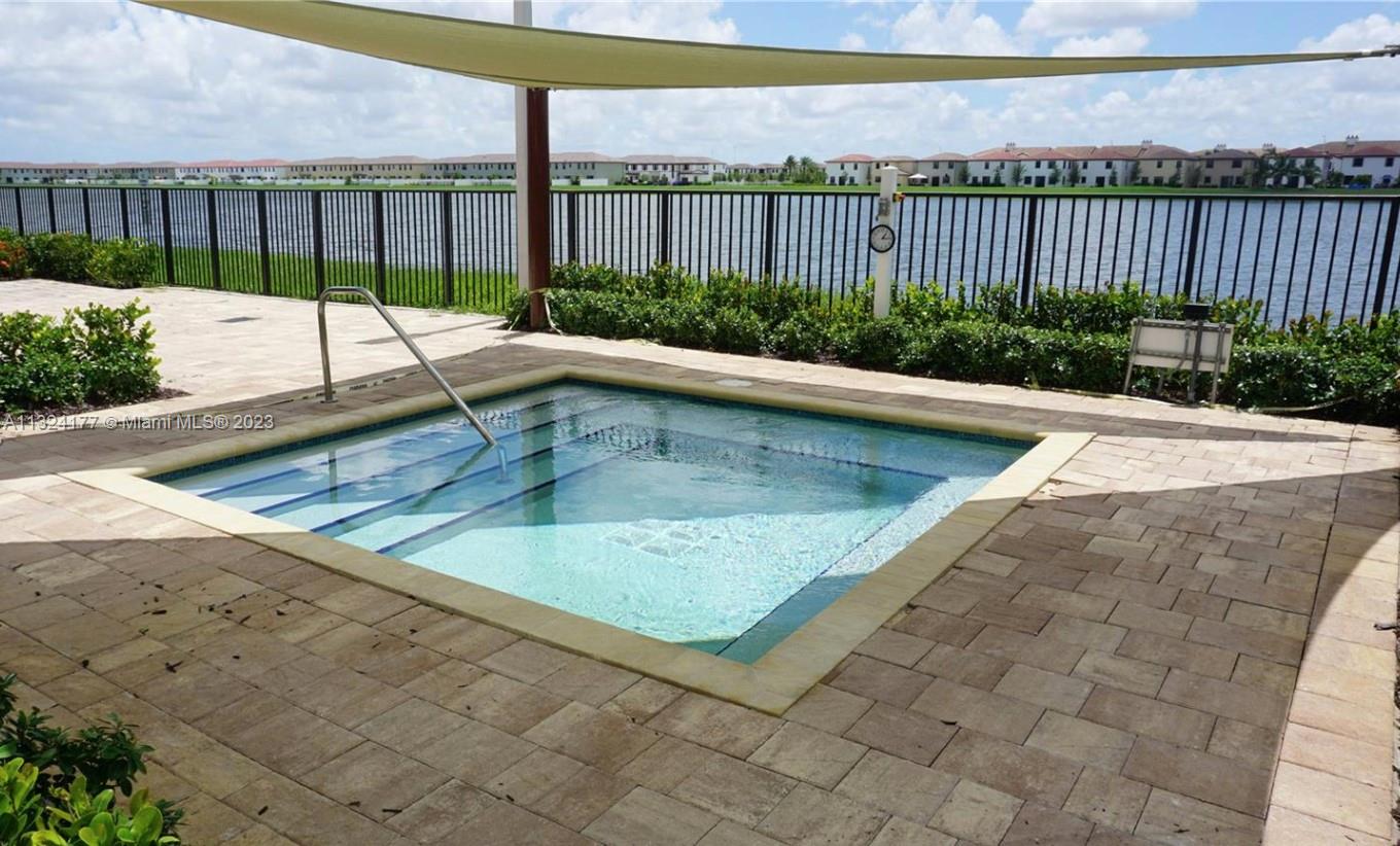 Hialeah Hialeah, FL 33018 - Photo 25 of 30 a view of a swimming pool with a lounge chairs