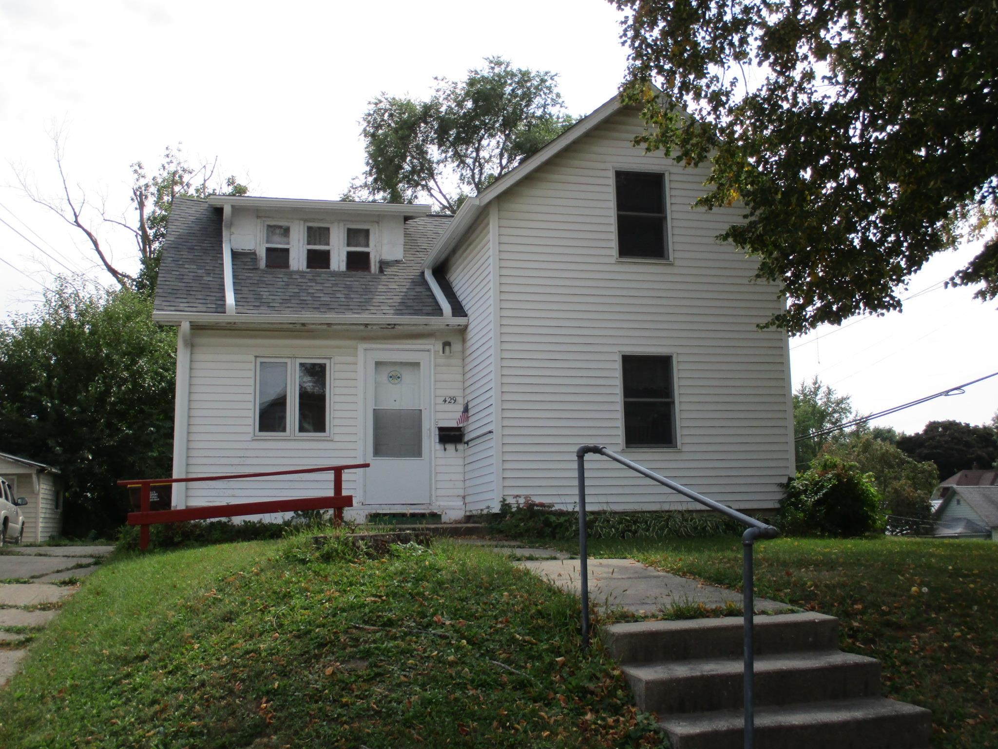 429 West American Street Freeport, IL 61032 - Photo 1 of 1 a front view of a house with a yard