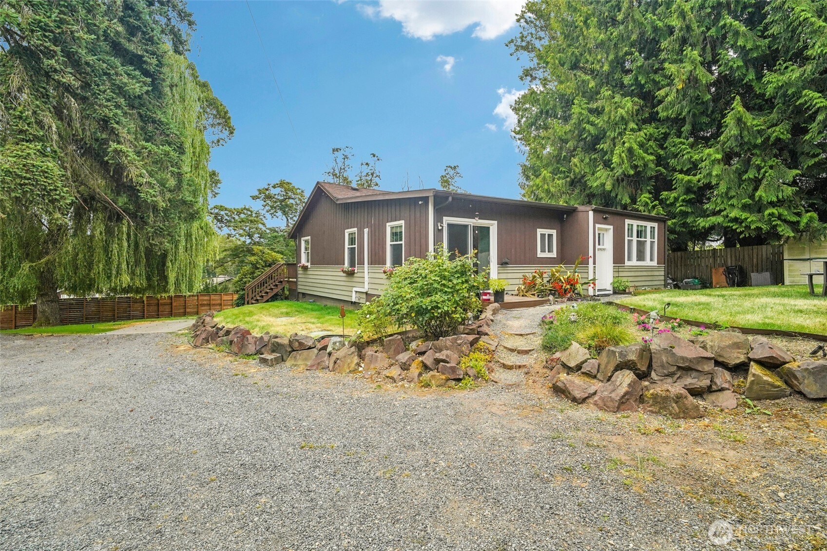 23716 Locust Way Bothell, WA 98021 - Photo 20 of 26 a view of a house with a yard and large tree