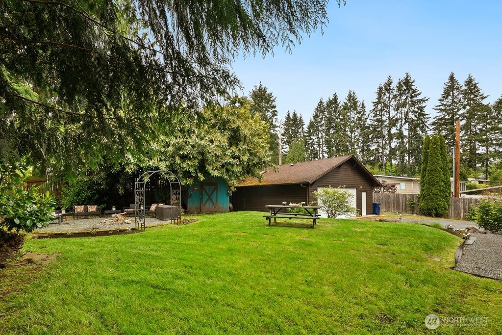 23716 Locust Way Bothell, WA 98021 - Photo 25 of 26 a front view of a house with garden