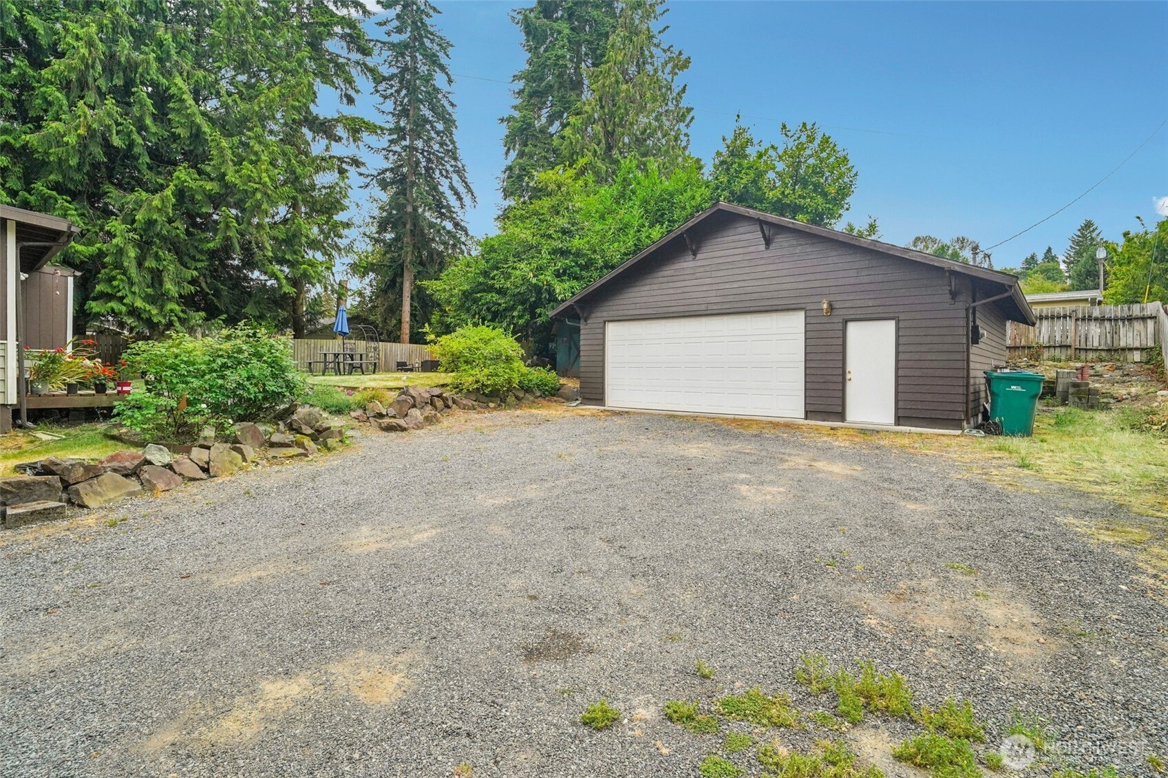 23716 Locust Way Bothell, WA 98021 - Photo 5 of 26 a view of a house with a yard and large trees