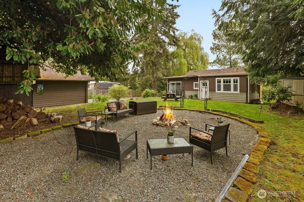 23716 Locust Way Bothell, WA 98021 - Photo 6 of 26 a view of a house with backyard and sitting area