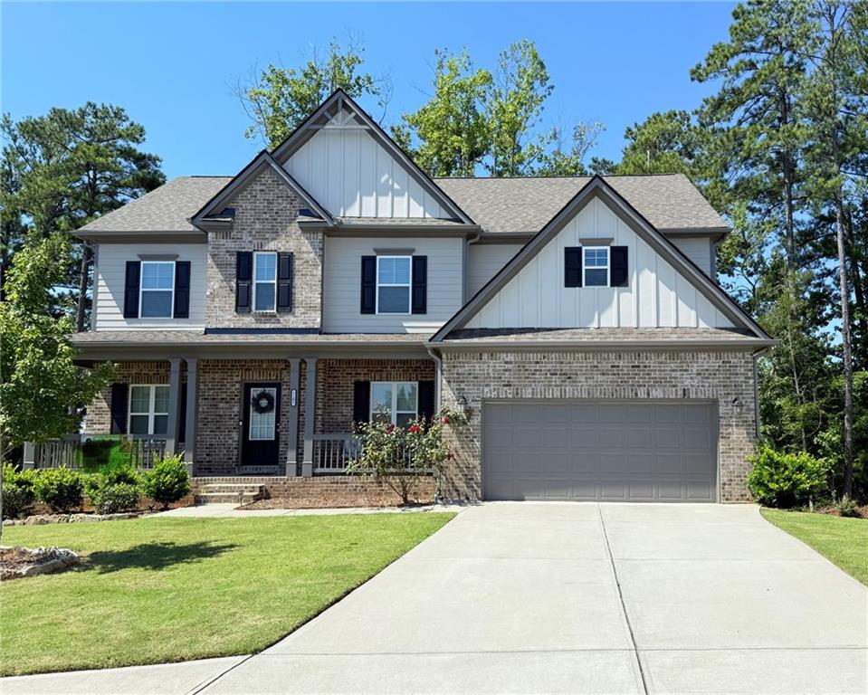 5101 Woodline View Circle Auburn, GA 30011 - Photo 1 of 26 a front view of a house with garden