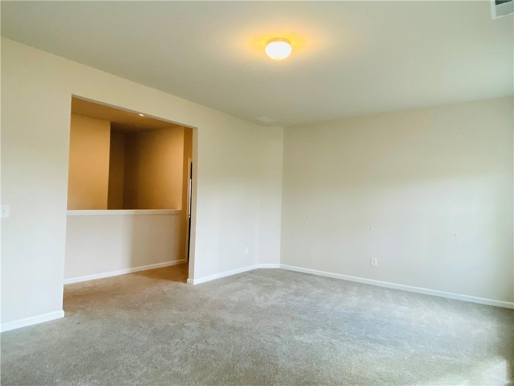 5101 Woodline View Circle Auburn, GA 30011 - Photo 19 of 26 a view of an empty room and window