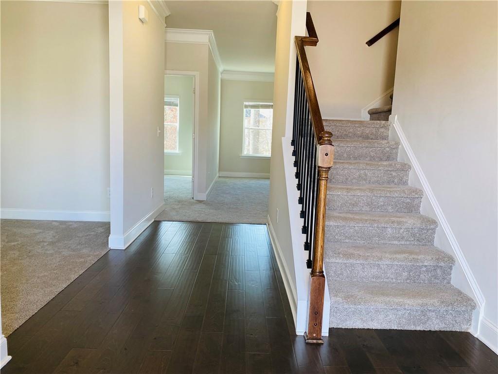 5101 Woodline View Circle Auburn, GA 30011 - Photo 2 of 26 a view of entryway and hall with wooden floor