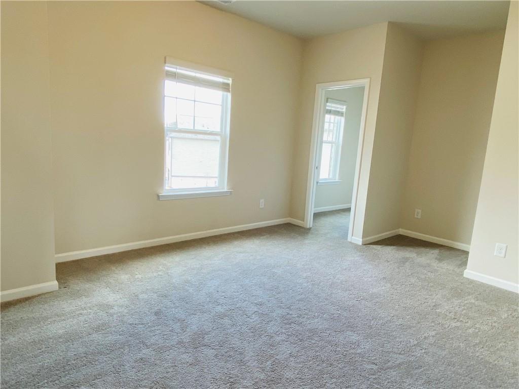 5101 Woodline View Circle Auburn, GA 30011 - Photo 22 of 26 an empty room with a window
