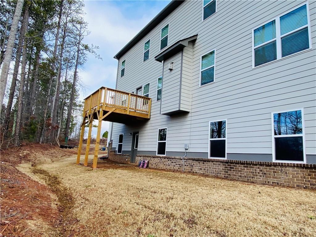 5101 Woodline View Circle Auburn, GA 30011 - Photo 25 of 26 a front view of a house with a yard