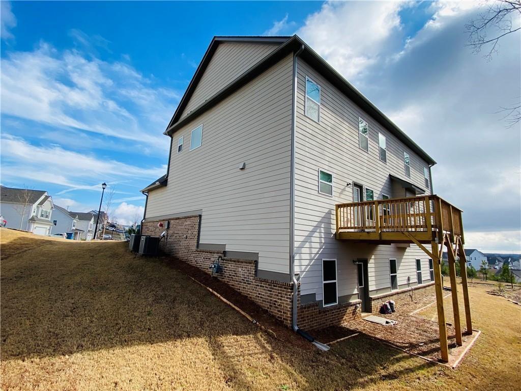 5101 Woodline View Circle Auburn, GA 30011 - Photo 26 of 26 a view of a house with a yard