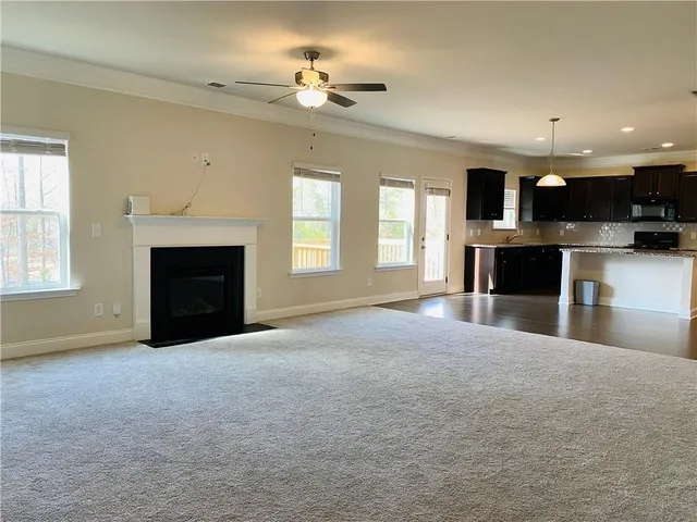 a view of kitchen with furniture and a fireplace