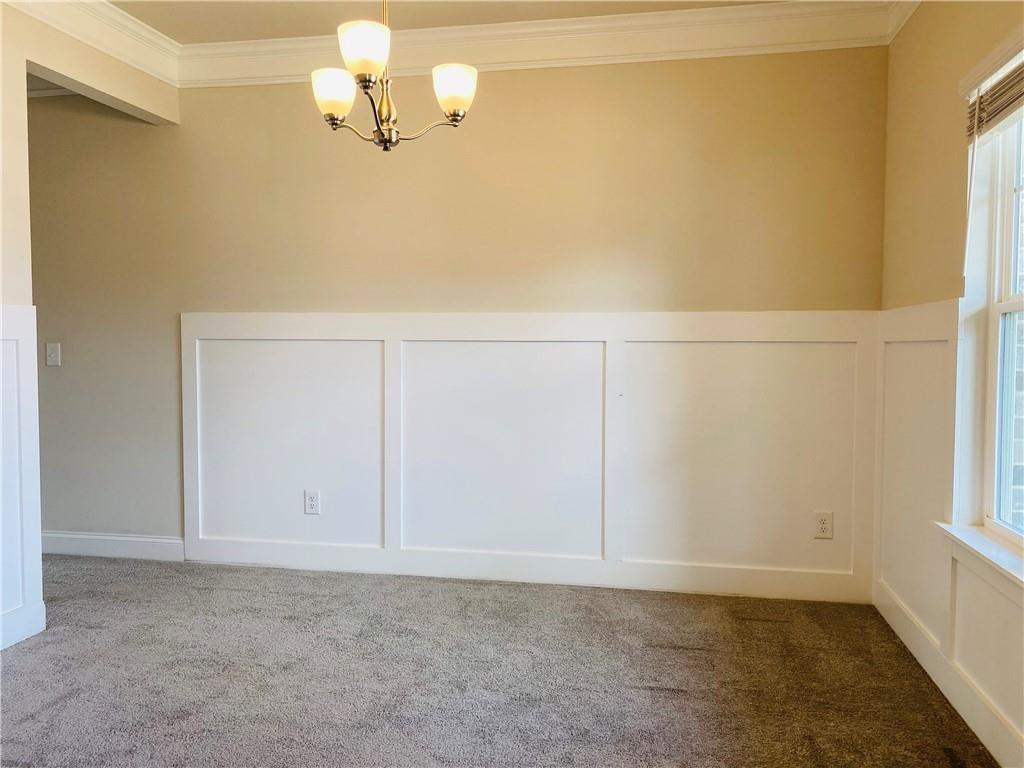 5101 Woodline View Circle Auburn, GA 30011 - Photo 7 of 26 a view of a small space with racks on the wall