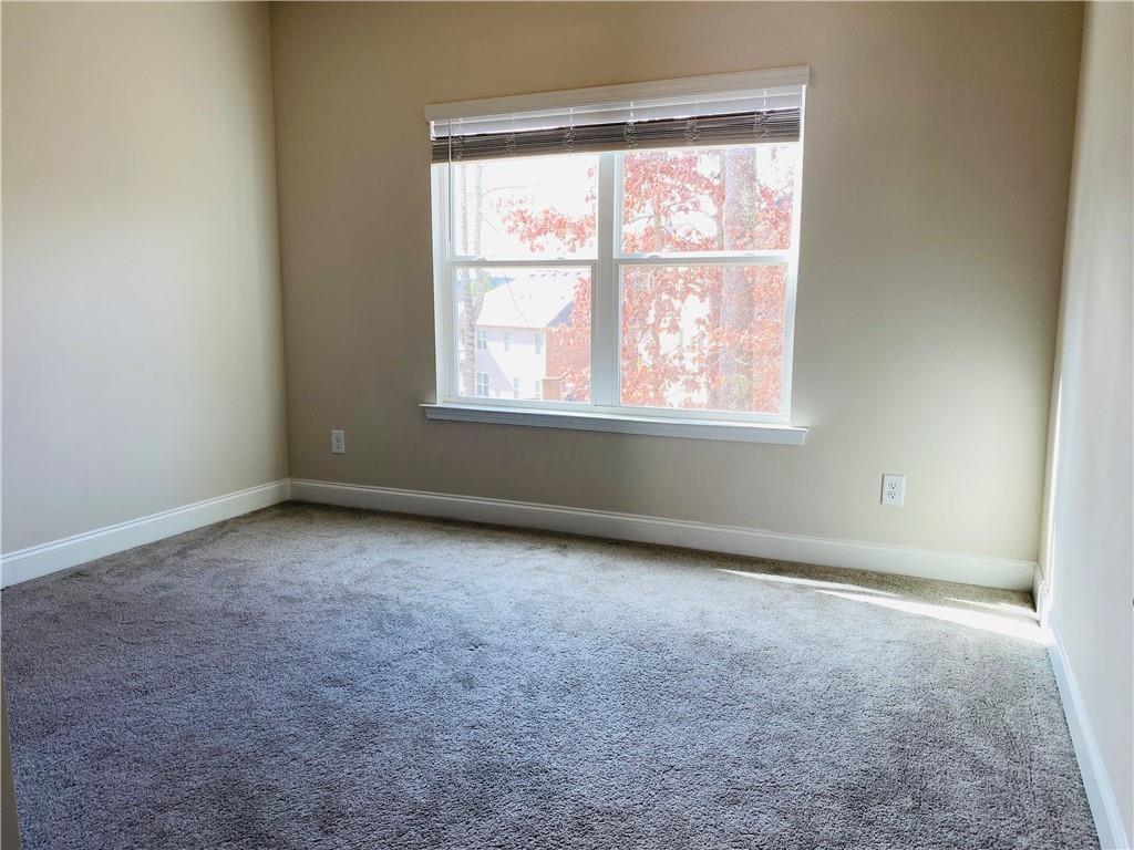5101 Woodline View Circle Auburn, GA 30011 - Photo 10 of 26 an empty room with a window