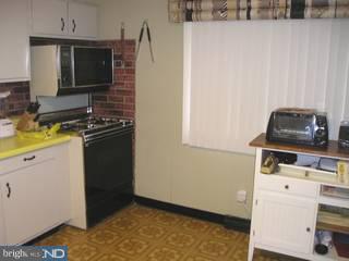 97 Country Club Road Pine Hill, NJ 08021 - Photo 2 of 6 a kitchen with a stove and a microwave