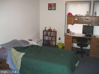 97 Country Club Road Pine Hill, NJ 08021 - Photo 5 of 6 a bed room with a bed and a television