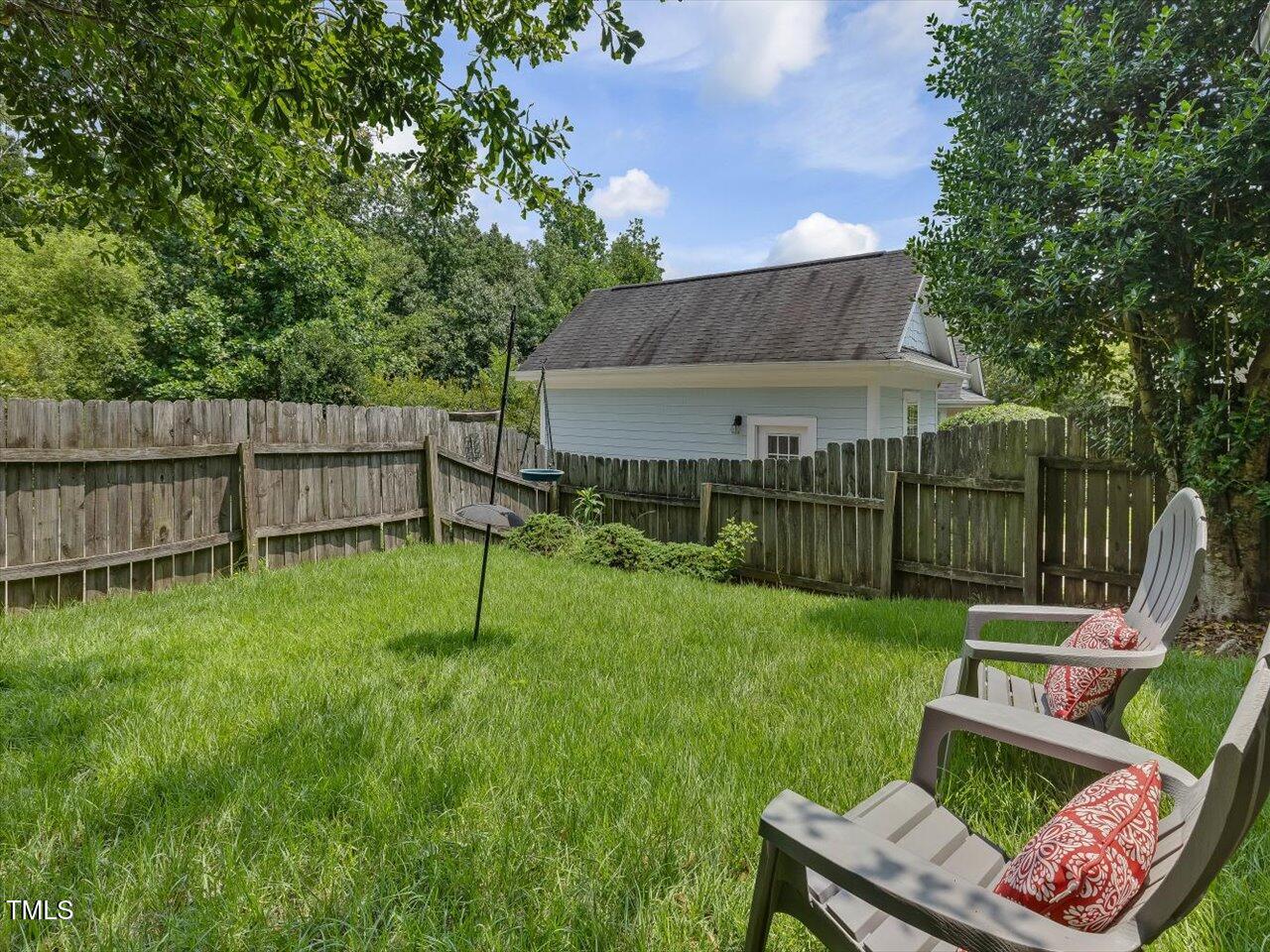 7712 ACC Boulevard Raleigh, NC 27617 - Photo 33 of 38 a view of an house with backyard space and sitting area