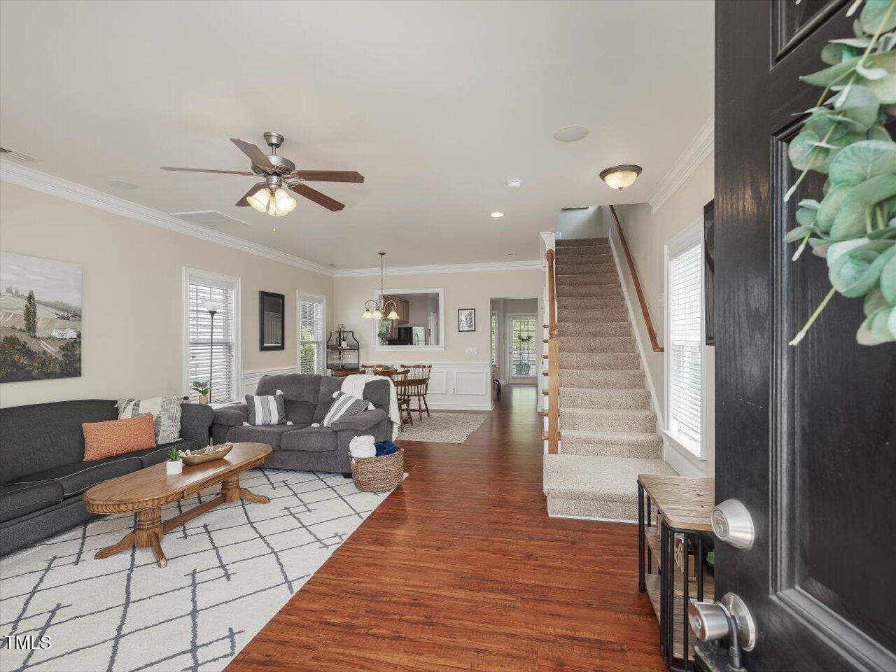 7712 ACC Boulevard Raleigh, NC 27617 - Photo 8 of 38 a living room with furniture and wooden floor