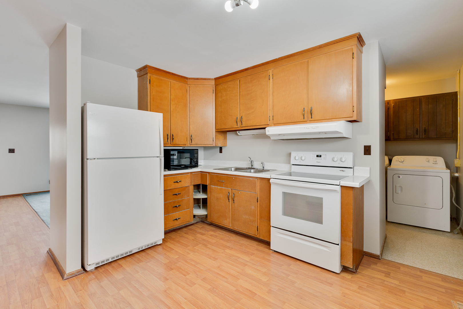 1240 Post Road Aurora, IL 60506 - Photo 5 of 15 a kitchen with a refrigerator sink and cabinets