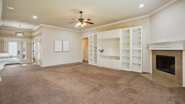 a view of an empty room with a fireplace