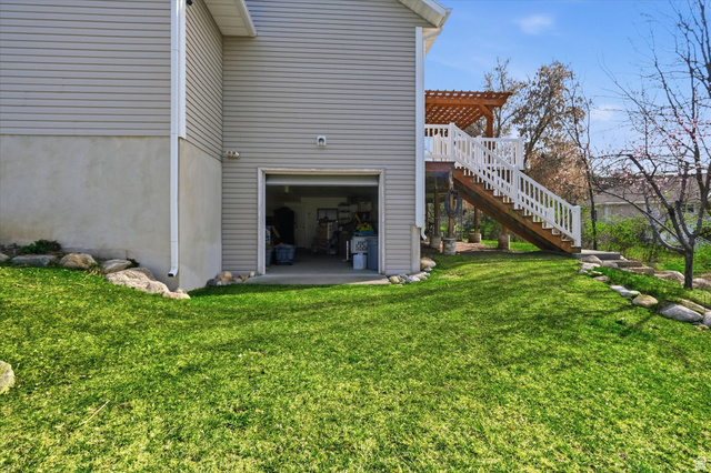 353 Robin Street Smithfield, UT 84335 - Photo 47 of 70 Rear view of property with a garage, a patio, a pergola, and a yard