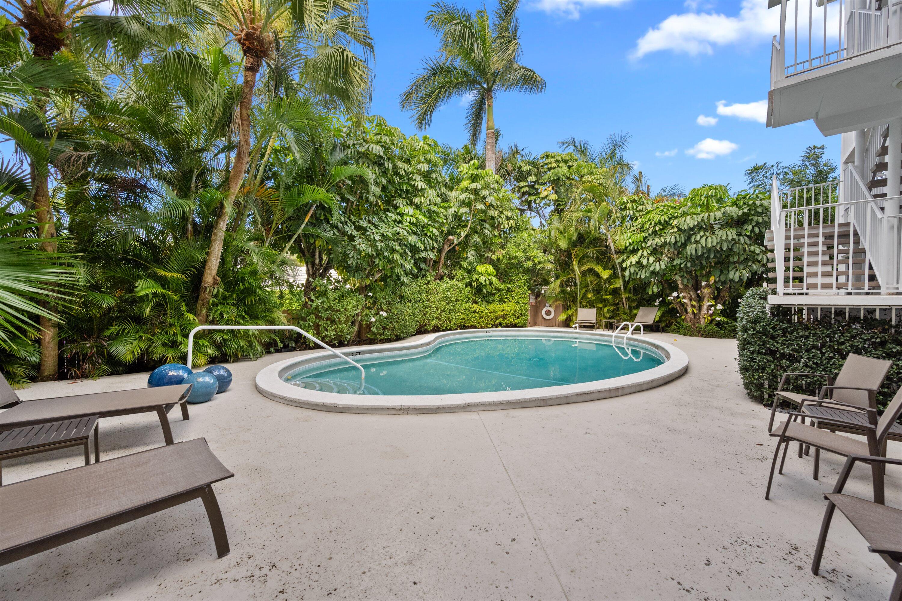 401 Peruvian Avenue, Unit 1010 Palm Beach, FL 33480 - Photo 13 of 19 a view of a swimming pool with a patio and plants