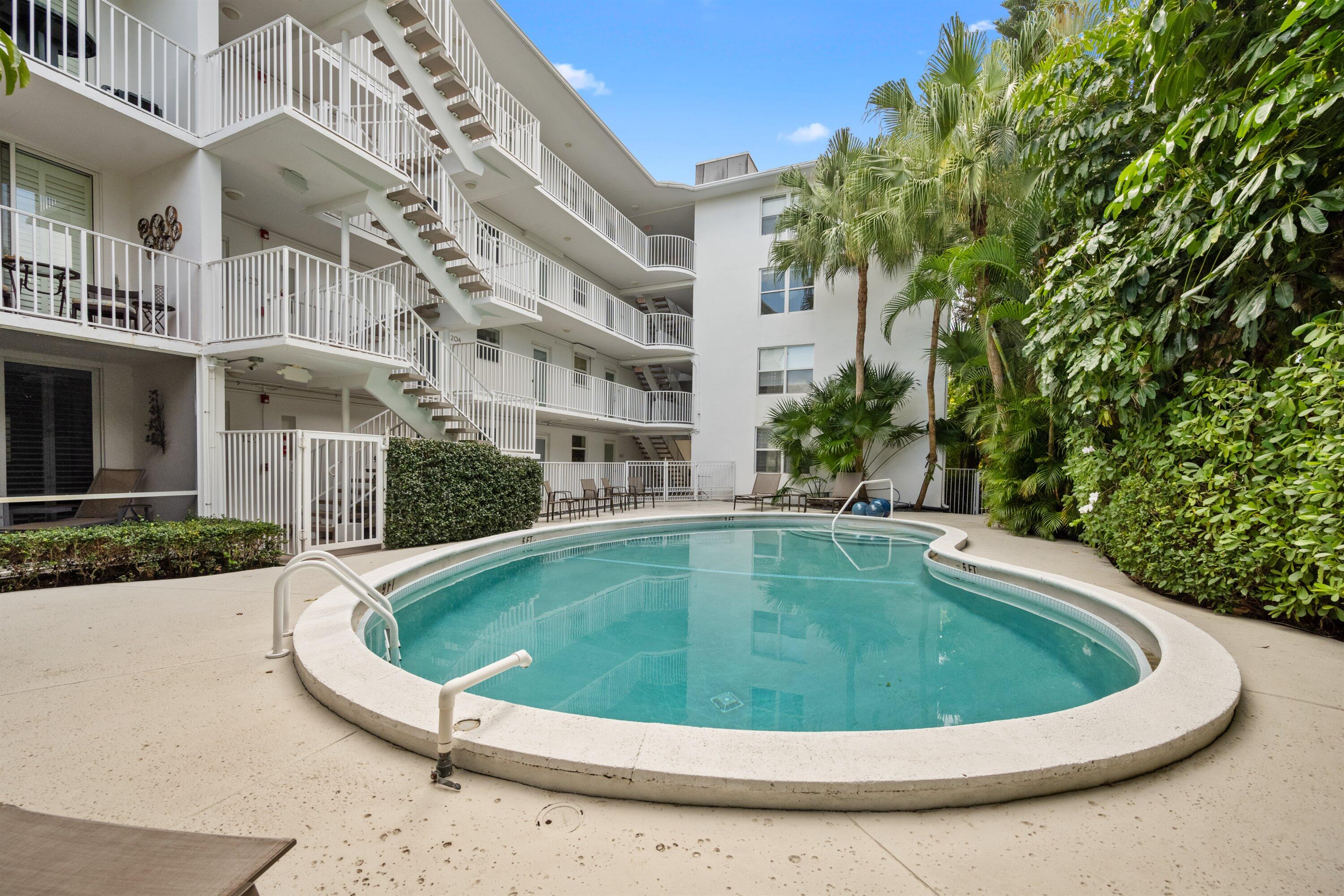 401 Peruvian Avenue, Unit 1010 Palm Beach, FL 33480 - Photo 14 of 19 a view of outdoor space yard swimming pool and patio