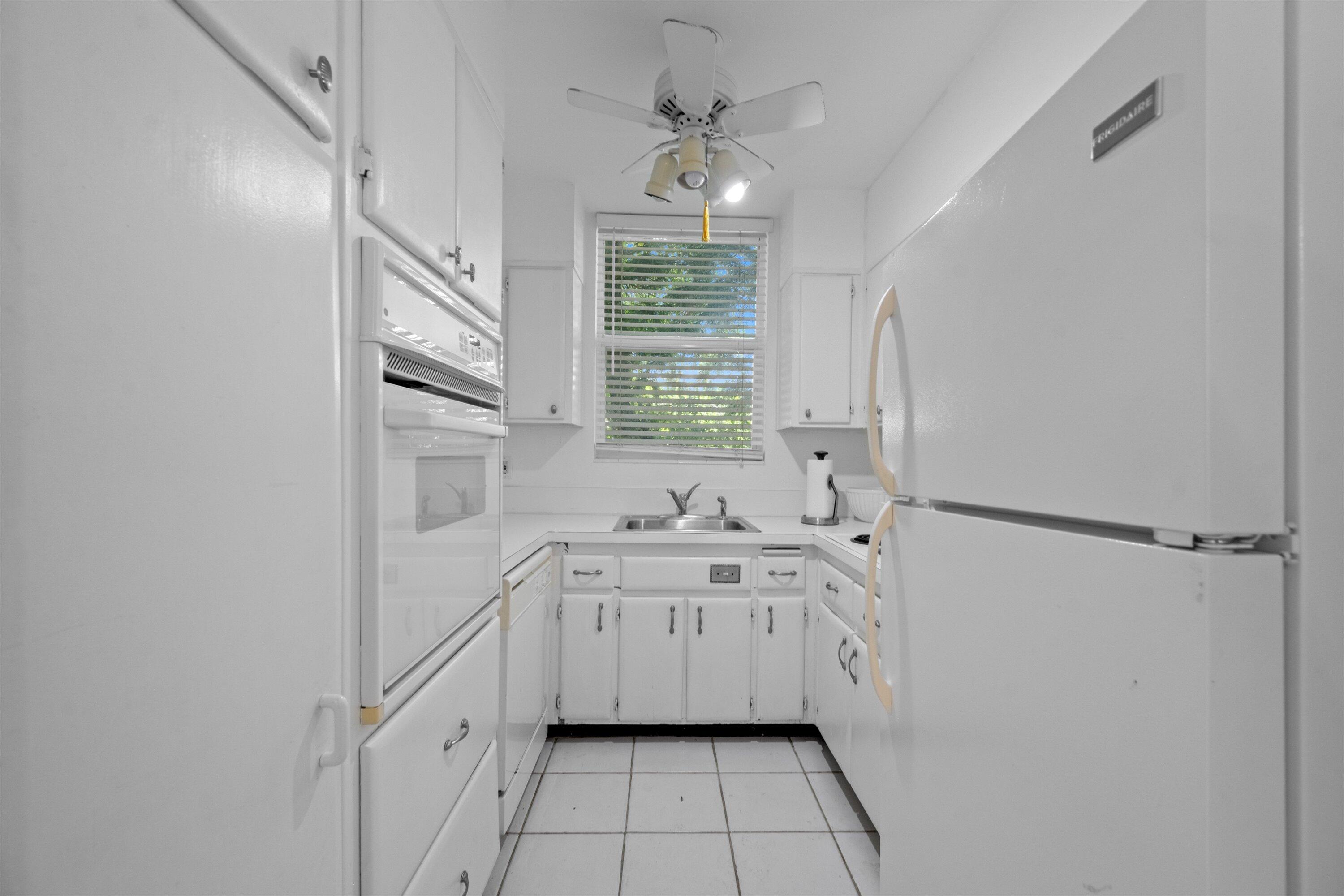 401 Peruvian Avenue, Unit 1010 Palm Beach, FL 33480 - Photo 6 of 19 a bathroom with a sink a mirror and a shower