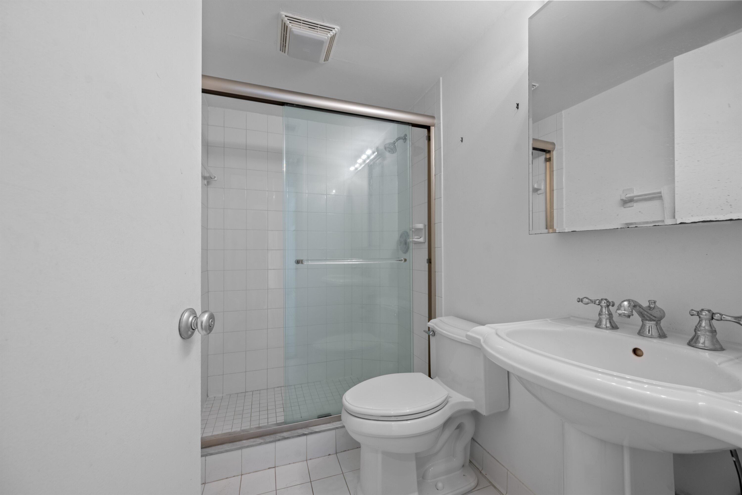 401 Peruvian Avenue, Unit 1010 Palm Beach, FL 33480 - Photo 10 of 19 a bathroom with a sink toilet and shower