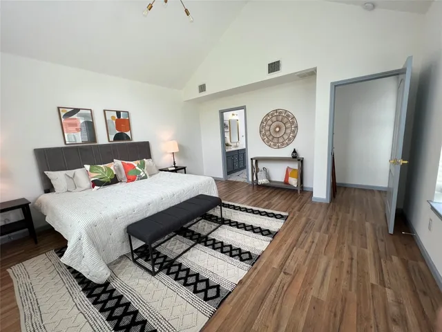 a bedroom with a bed and a table