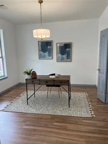 a view of a livingroom with furniture and lounge chair