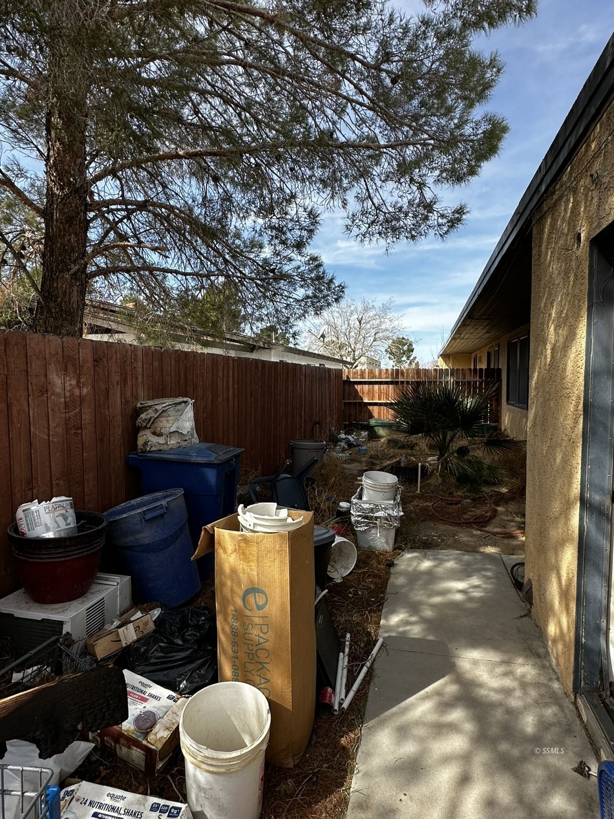 301 South Richmond Road Ridgecrest, CA 93555 - Photo 19 of 45 a backyard of a house with outdoor seating