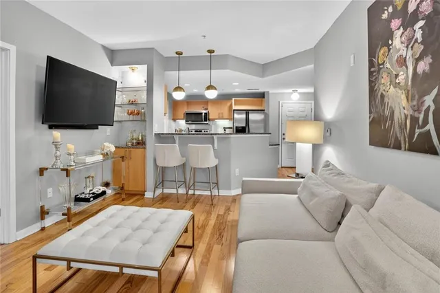 a living room with furniture and a flat screen tv