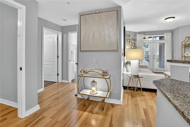 a living room with furniture and wooden floor