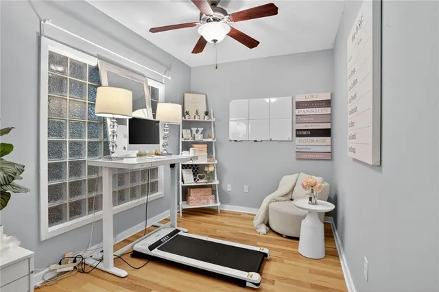 a room with furniture and view of kitchen
